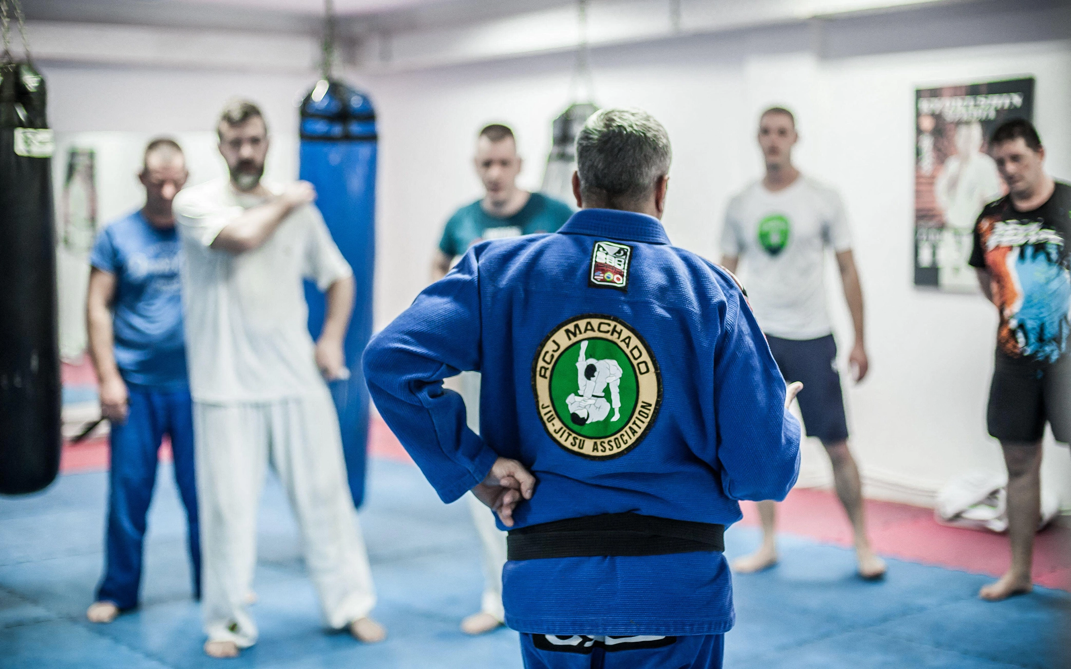 Martial arts instructor wearing a custom Brazilian Jiu Jitsu gi patch during dojo training
