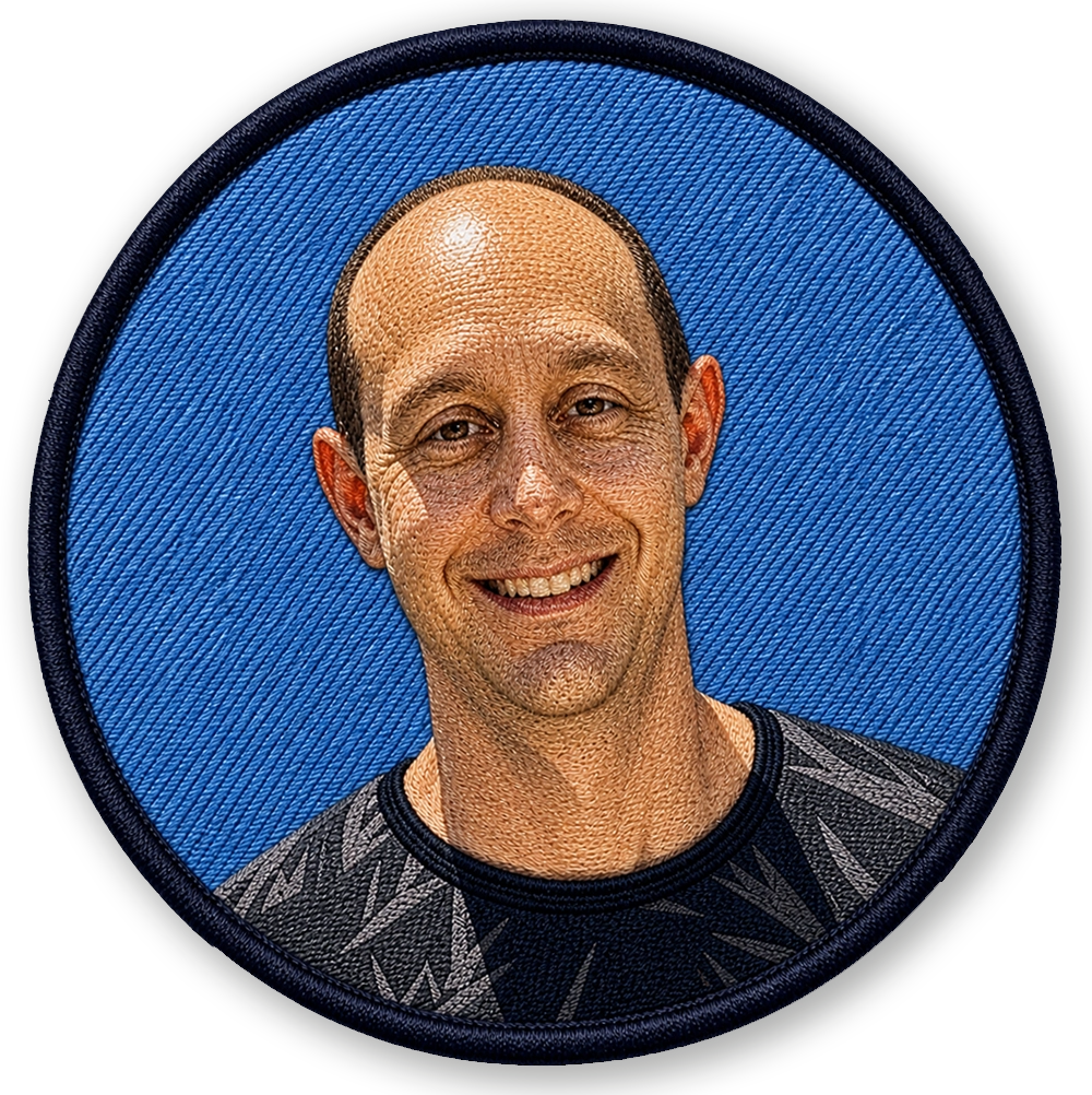 Rick from MrBadges, design and production coordinator managing artwork and production